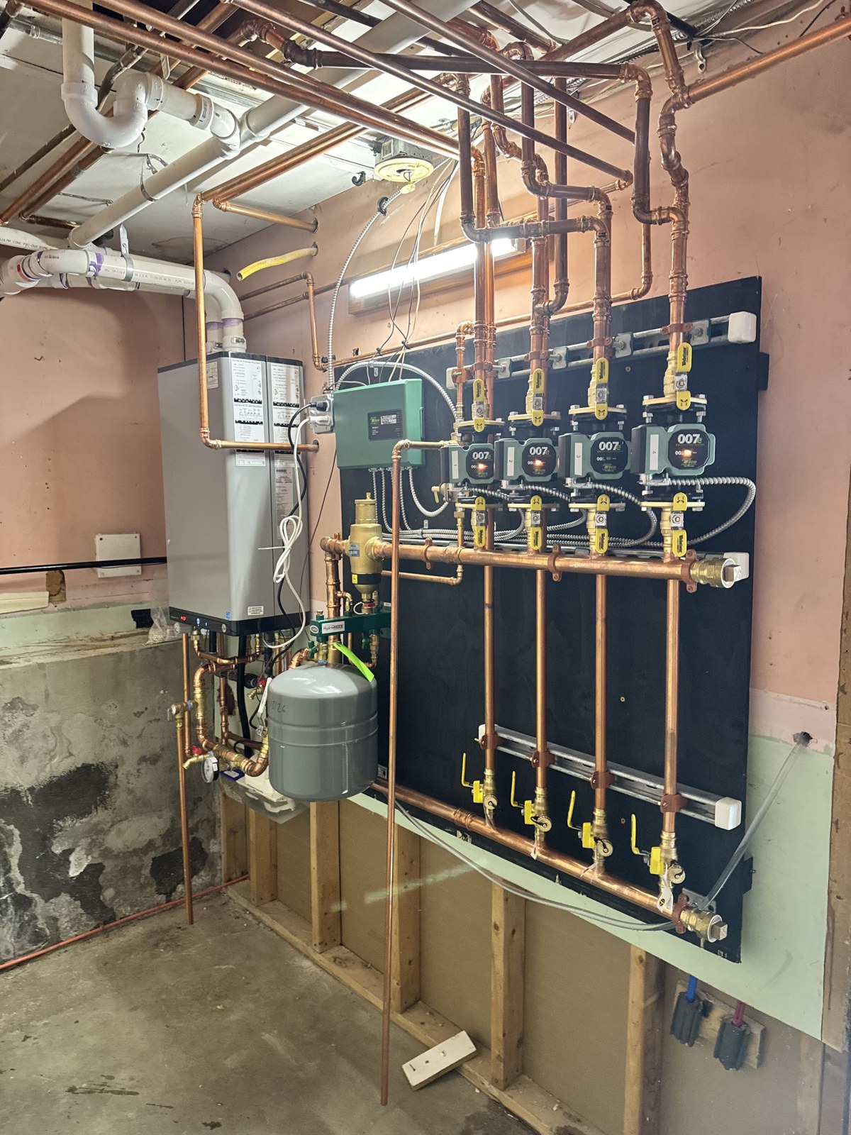 New high-efficiency combi boiler with zoned hydronic piping installed in Derry NH