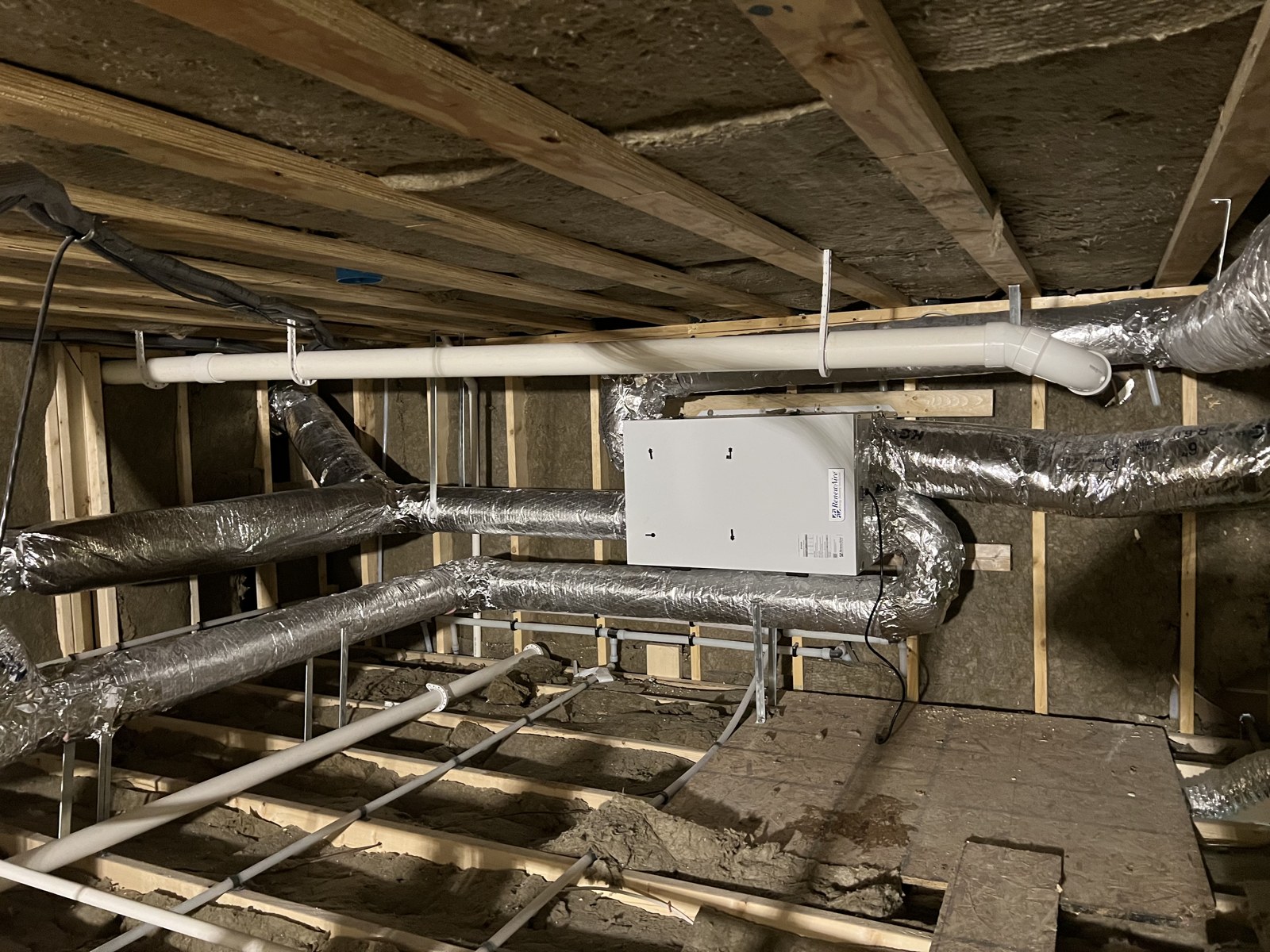 ERV ventilation system with insulated ductwork installed in a tight Meredith NH crawlspace